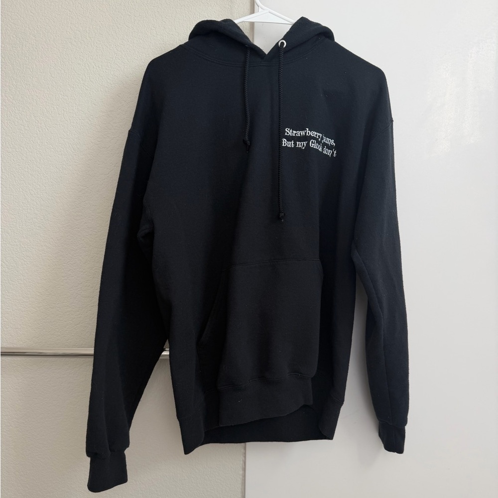 Strawberry jams black hoodie size medium has paint on sleeve